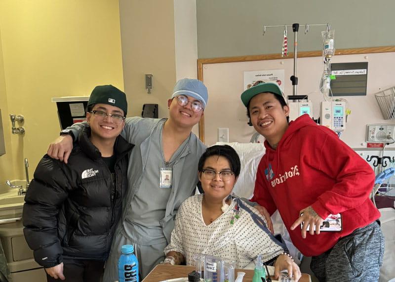 Jio Rodriguez during a visit from his brothers while recovering in the hospital after heart surgery in February 2024. From left: John, Jio, Brian and Byronn Rodriguez. (Photo courtesy of Jio Rodriguez)